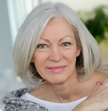 A headshot of a smiling middle-aged woman representing a customer testimonial from Fresno, California, regarding improved daily energy levels.